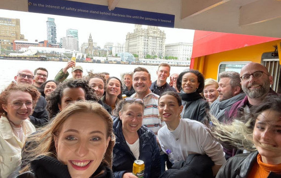 The whole team on a liverpool ferry, on summer away-day