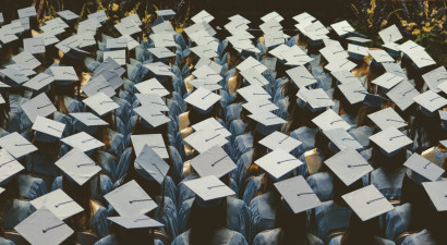 Graduates_in_graduation_cap_and_gown.jpg