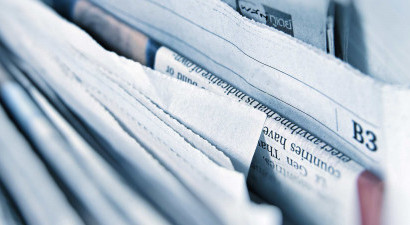Newspaper pile up close