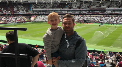 Father & son at football stadium