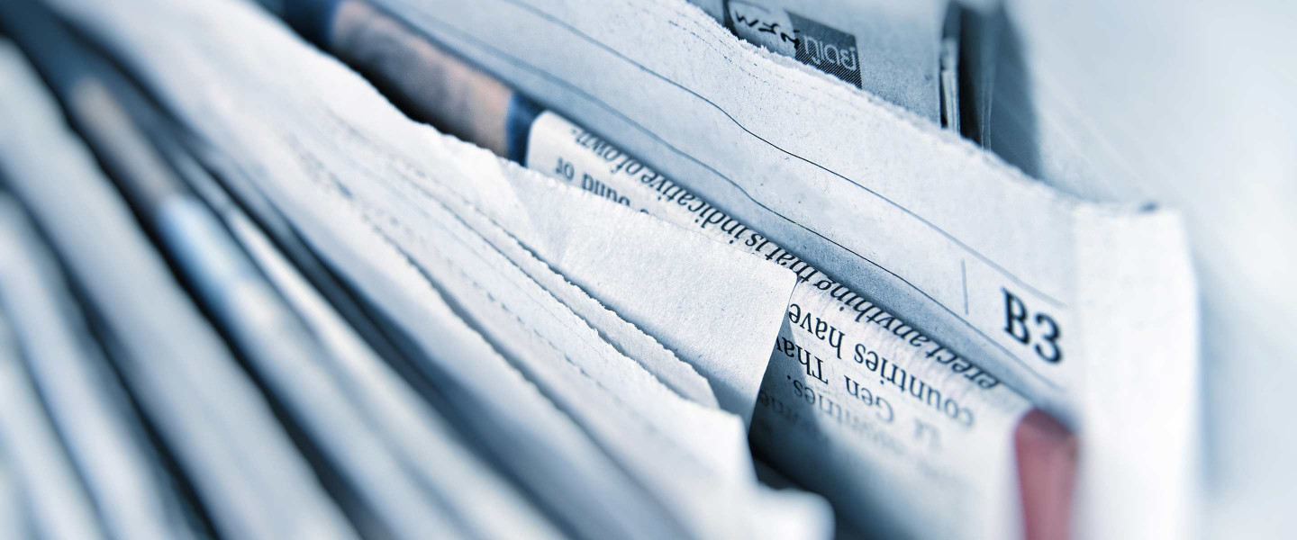 Newspaper pile up close