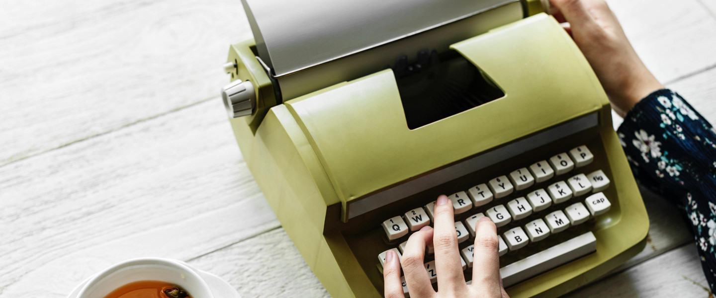 Woman using typewriter