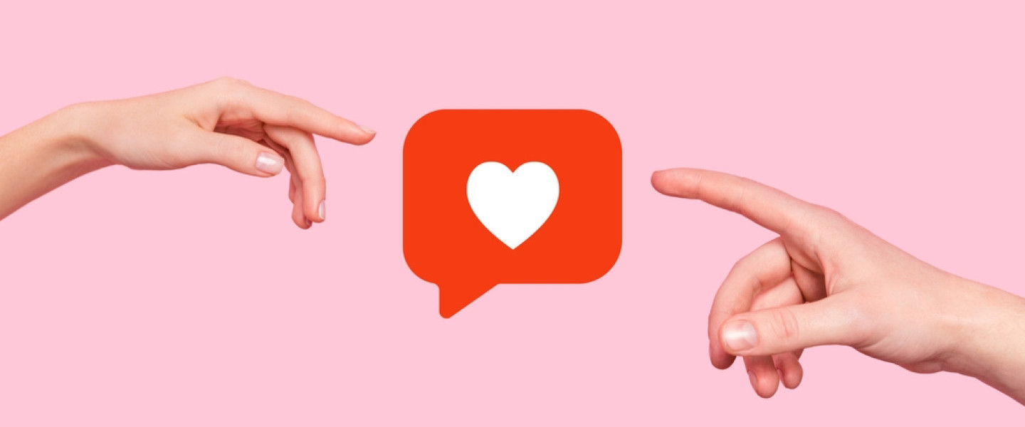 two_hands_reaching_towards_a_social_media_like_icon.jpg